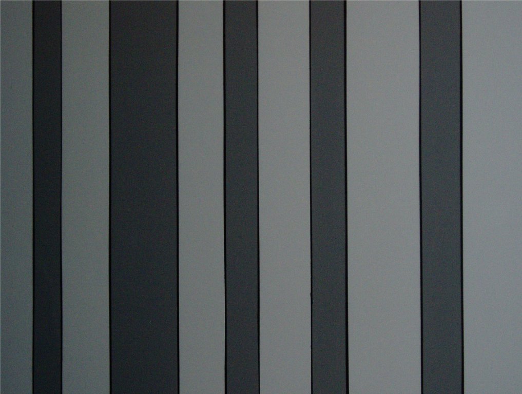I am a black, dark gray and light gray stripe faux finish. I used to be dark paneling but now I've been upgraded to a modern look!